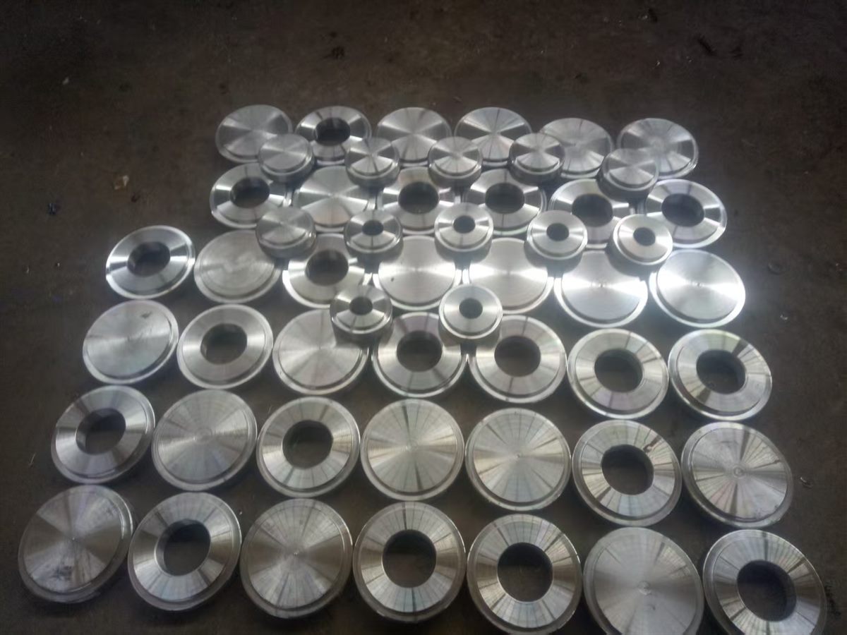Blind and spacer plates bored and recessed in a batch