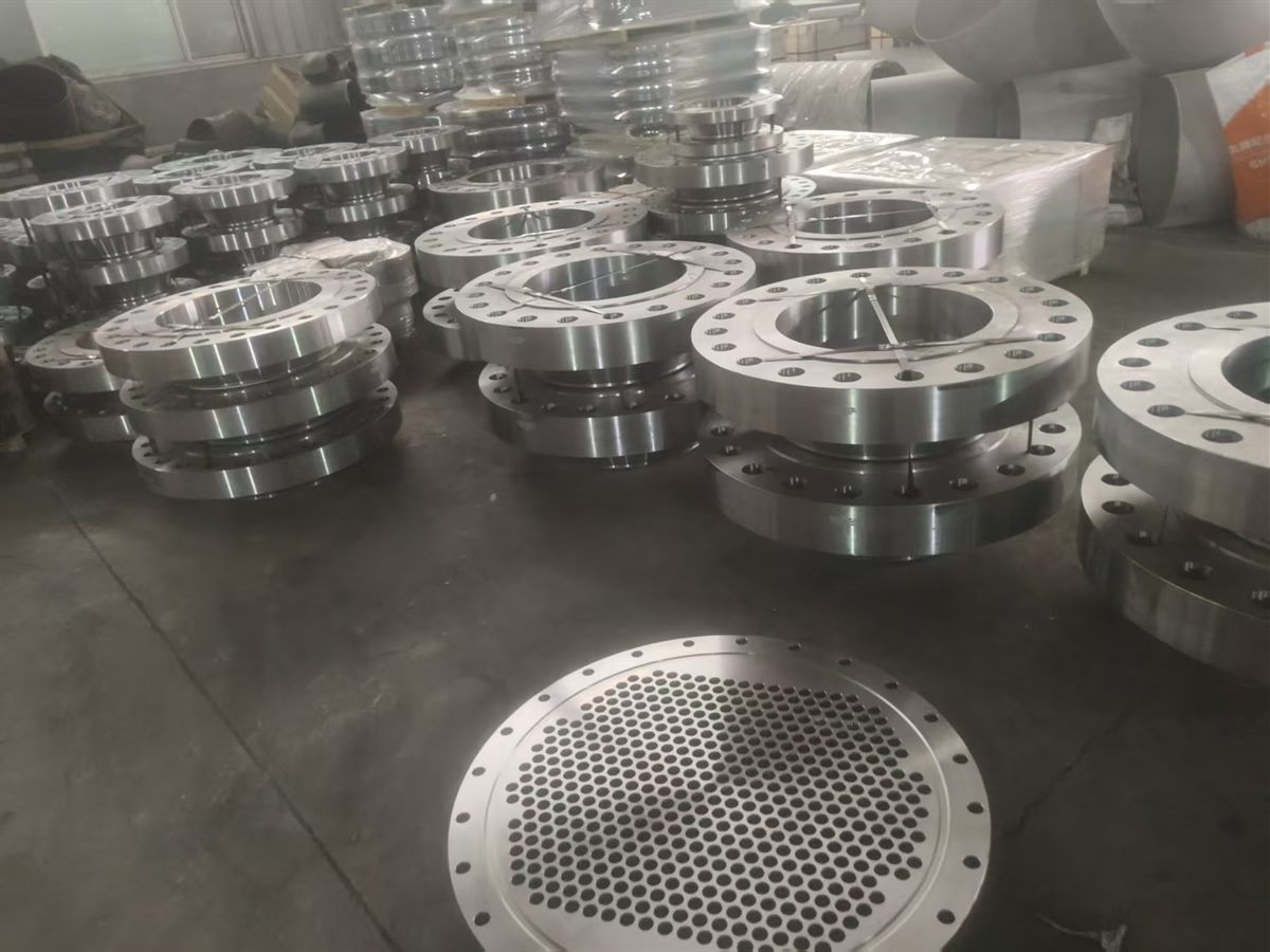 Large custom flanges wrapped and stored for shipment